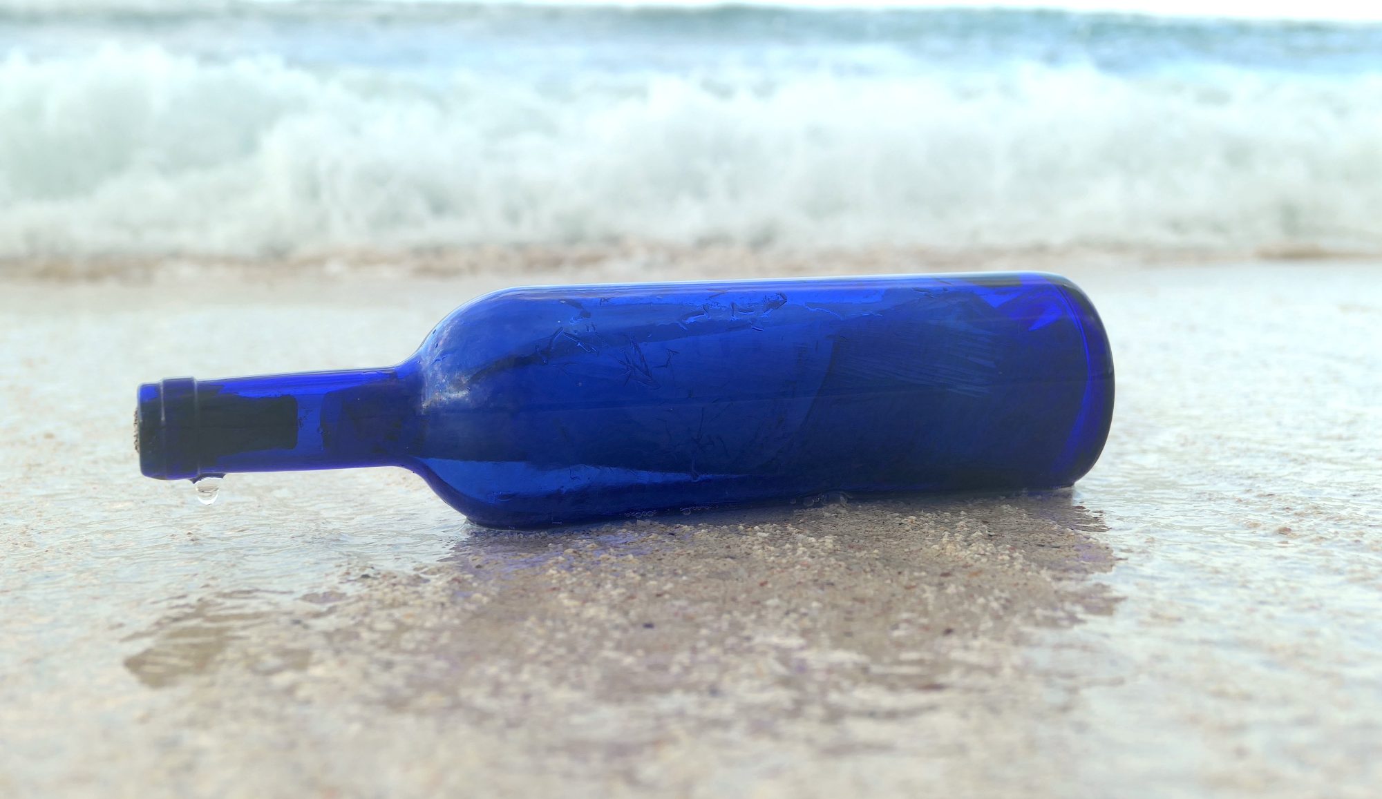 Blue Bottle on a beach